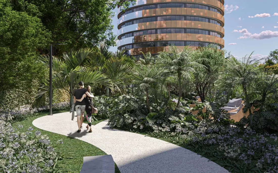 Caminho entre os jardins do Niemeyer 360° Residences, com a torre ao fundo
