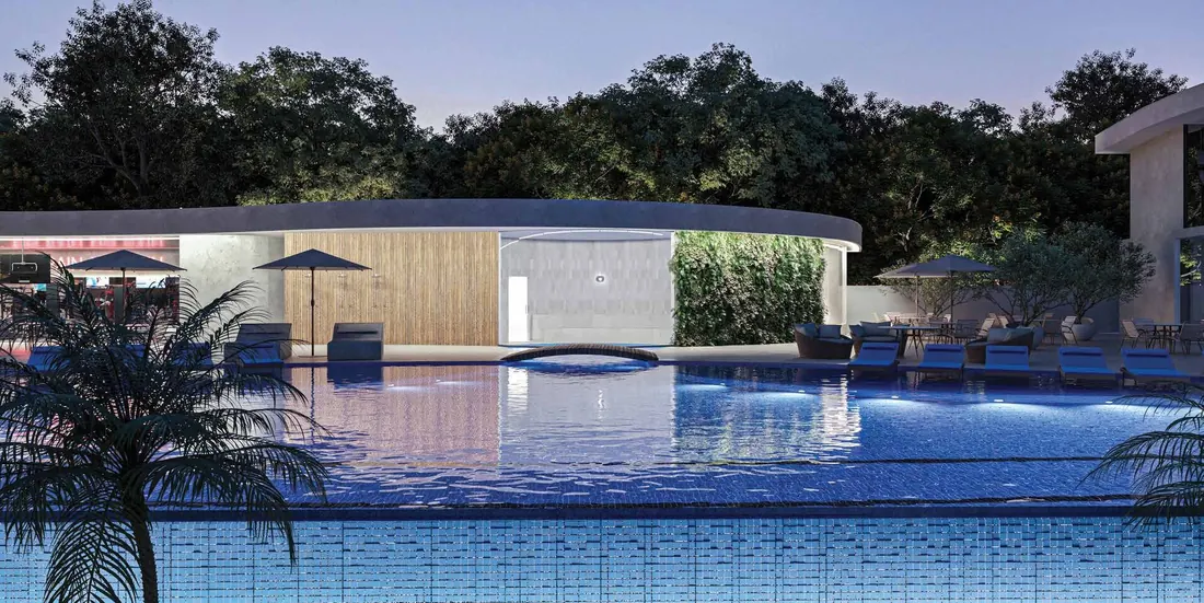 Piscina de borda infinita do Niemeyer 360° Residences à noite